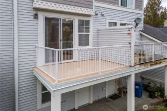 Upper Deck and lower patio with grass area
