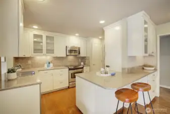 Kitchen flows to dining and kitchen and lounging area.