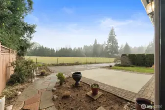 Beautiful stone path on the side leads you to the driveway in the back