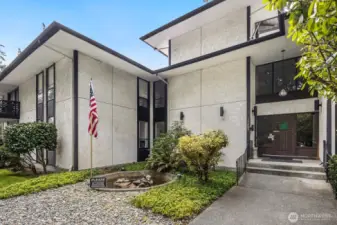 East facing entrance over looks beautiful tall trees, private parking area