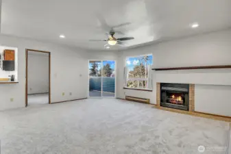 As you enter the home, you are greeted by a light and bright open living and dining area with new carpet.