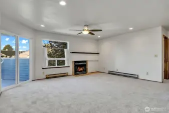 Relax in the living room where you have a slider door that steps out to balcony, an additional large picture window that overlooks the grounds and a warm wood burning fireplace that brings warmth and ambiance to the room.