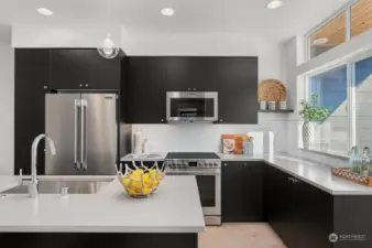 Photos of model home 9213 with similar finishes & floor plan.