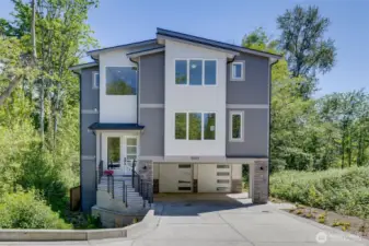 Gorgeous 3-level home with carport AND garage!