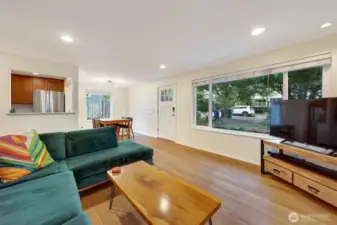 Living room looking to front and dining area.