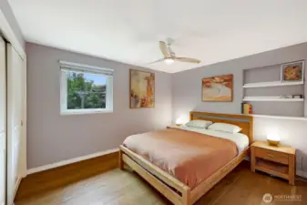 Main bedroom at back side of house. Ceiling fan complements the A/C.