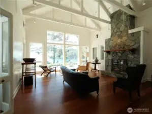 Light-filled living room with grand fireplace