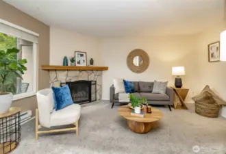 Inviting living room area with wood fireplace