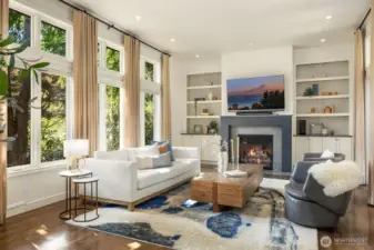 Built-ins & cozy wood-burning fireplace with gas starter