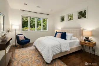 Main floor guest bedroom with maple hardwood flooring added in 2022. Maple hardwood also extended in the office, stairs & upstairs hallway.