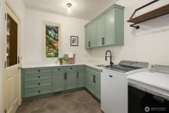 Remodeled in 2021 with painted cabinets, new tile floor & quartz countertop. Separate entrance exterior door to the side of the house plus storage closet & Maytag washer & dryer.