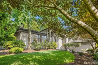 Mature, manicured gardens & landscaping. Beautiful Japanese maples in the front yard & different foliage that blossoms each season.