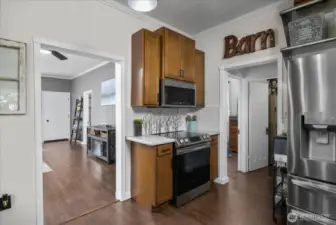 Kitchen, with bedroom and bath off to the right