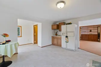 Oversized kitchen with a dining room area on the left ...
