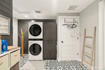Large laundry room with lots of storage.