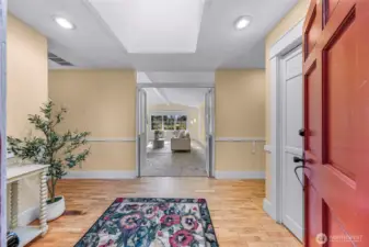 Skylight above bathes the front entrance in light