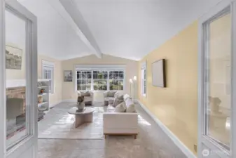 Double glass doors invite you into the large gathering room