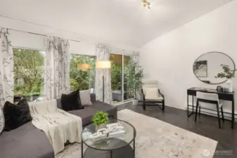 Take in the PNW beauty through this wall of updated windows and door slider. This level offers space for a suitable home office set up.