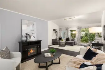 The warmth and glow of a living room fire feature. You can see three distinct areas of this level. Casual sitting area, formal living room area, and your perfect home office area!
