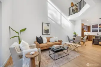 Open floorplan with soaring ceilings and windows to match.