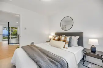 Third level bedroom has ample room for queen size bed and more!  Photo is of model home of same floorplan. Color schemes of finishes may vary.