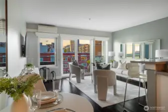 With no neighbors above, tall ceilings, and expansive windows, the space feels airy, bright, and open