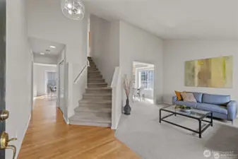 Airy, Bright & Unforgettable    The heart of this home is a sun-drenched living room where soaring vaulted ceilings create an immediate sense of scale and freedom. Designed to feel both grand and inviting, the open architecture draws the eyes upward, amplifying the natural light and providing the perfect, breathable backdrop for everything from lively family celebrations to quiet morning coffee. It’s more than just a room; it’s an atmosphere.