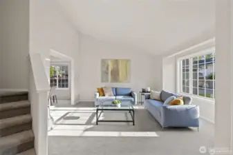 Airy, Bright & Unforgettable    The heart of this home is a sun-drenched living room where soaring vaulted ceilings create an immediate sense of scale and freedom. Designed to feel both grand and inviting, the open architecture draws the eyes upward, amplifying the natural light and providing the perfect, breathable backdrop for everything from lively family celebrations to quiet morning coffee. It’s more than just a room; it’s an atmosphere.