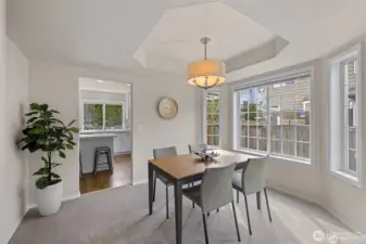 Step into a dining room where architectural detail meets effortless light. The centerpiece of this space is a stunning cove ceiling, adding a layer of sophisticated depth and character that elevates every meal into an occasion.  ?Bathed in shimmering natural light, this room offers a refined yet airy atmosphere for hosting everything from intimate holiday dinners to vibrant Sunday brunches. It’s a space that feels both distinct and perfectly integrated, providing a polished backdrop that truly shines.