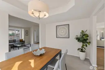 Step into a dining room where architectural detail meets effortless light. The centerpiece of this space is a stunning cove ceiling, adding a layer of sophisticated depth and character that elevates every meal into an occasion.  ?Bathed in shimmering natural light, this room offers a refined yet airy atmosphere for hosting everything from intimate holiday dinners to vibrant Sunday brunches. It’s a space that feels both distinct and perfectly integrated, providing a polished backdrop that truly shines.