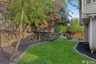 Your Private Outdoor Haven  Step outside to a fully fenced 6,098 sf backyard designed for both play and relaxation. This secure sanctuary features a spacious patio perfect for summer BBQs and alfresco dining, while dedicated gardening spaces invite you to cultivate your own PNW oasis. Whether it’s a secure area for pets to roam or a quiet corner for your morning coffee, this versatile outdoor retreat seamlessly extends your living space into the fresh air.
