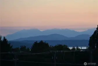 An Elton Bennett-like sunset over the Olympic Mountains.  (Bennett was a local artist that made silkscreen paintings that looked like this sunset.)
