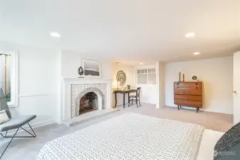 Fireplace and desk space in lower level bedroom.