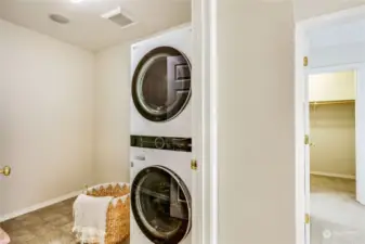 The upstairs Utility Room is spacious with stacked Washer/Dryer.