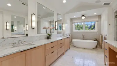 Carrera marble counters, heated floors, custom cabinetry - no luxury is spared in this incredible bathroom!