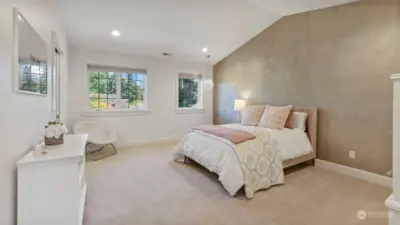 Two spacious secondary bedroom suites mirror each other with walk-in closets and built-ins.