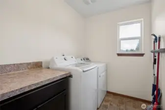 The laundry room is more than just a place for laundry, it’s a space for everything you need. With a counter for folding, crafting, or gift wrapping, plus cabinets for extra storage, this room’s got you covered. And don’t forget the brand-new LG washer, easy vinyl floors, and a window that opens for that fresh-air vibe.