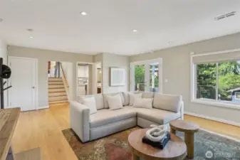 Lower rec room with beautiful fireplace and direct access to the deck.