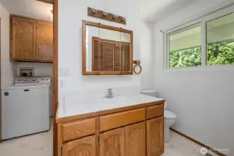 Guest bathroom looking through to laundry room