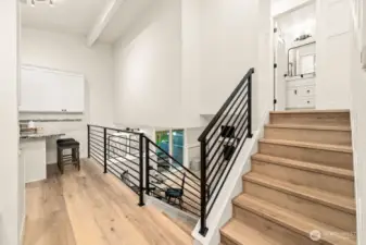 Hallway with modern railing to all levels.