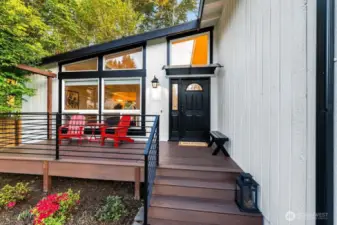 Front entry with Trex decking and modern railing.