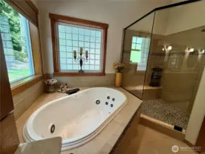Elegant spacious shower w/ bench.