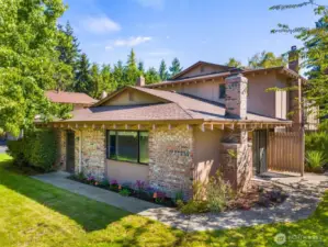 The association maintains the lawn as owners add character and color to their flower beds.