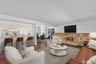 Photo Virtually Staged - With counter seating, a dining nook, and an open living room, there’s plenty of room to enjoy life.