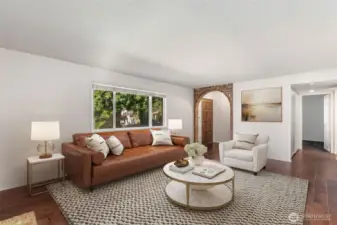 Virtually Staged Photo - a hallway beyond the kitchen leaders to both bedrooms, storage, the bathroom, and the in-unit laundry.