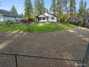 Fully fenced with gravel area towards the back - great for dogs!