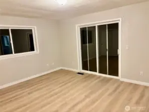 Primary bedroom has multiple closets and it's own deck off the back.