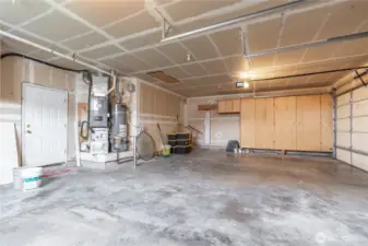 Easy access to water heater and furnace recently serviced and installed. Furnace (2021), Water Heater (2018), and AC located just outside of back garage door.  Lots of storage space.