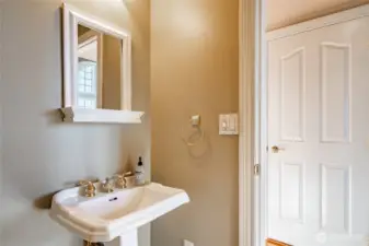 Main floor 1/2 bathroom.out the door to the left is the formal dining/Family Room. To the right goes into the kitchen dining area.