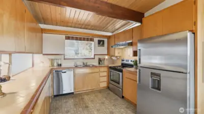Matching stainless steel appliances and appeal and function in this spacious kitchen. Don't miss the custom spice cabinet!
